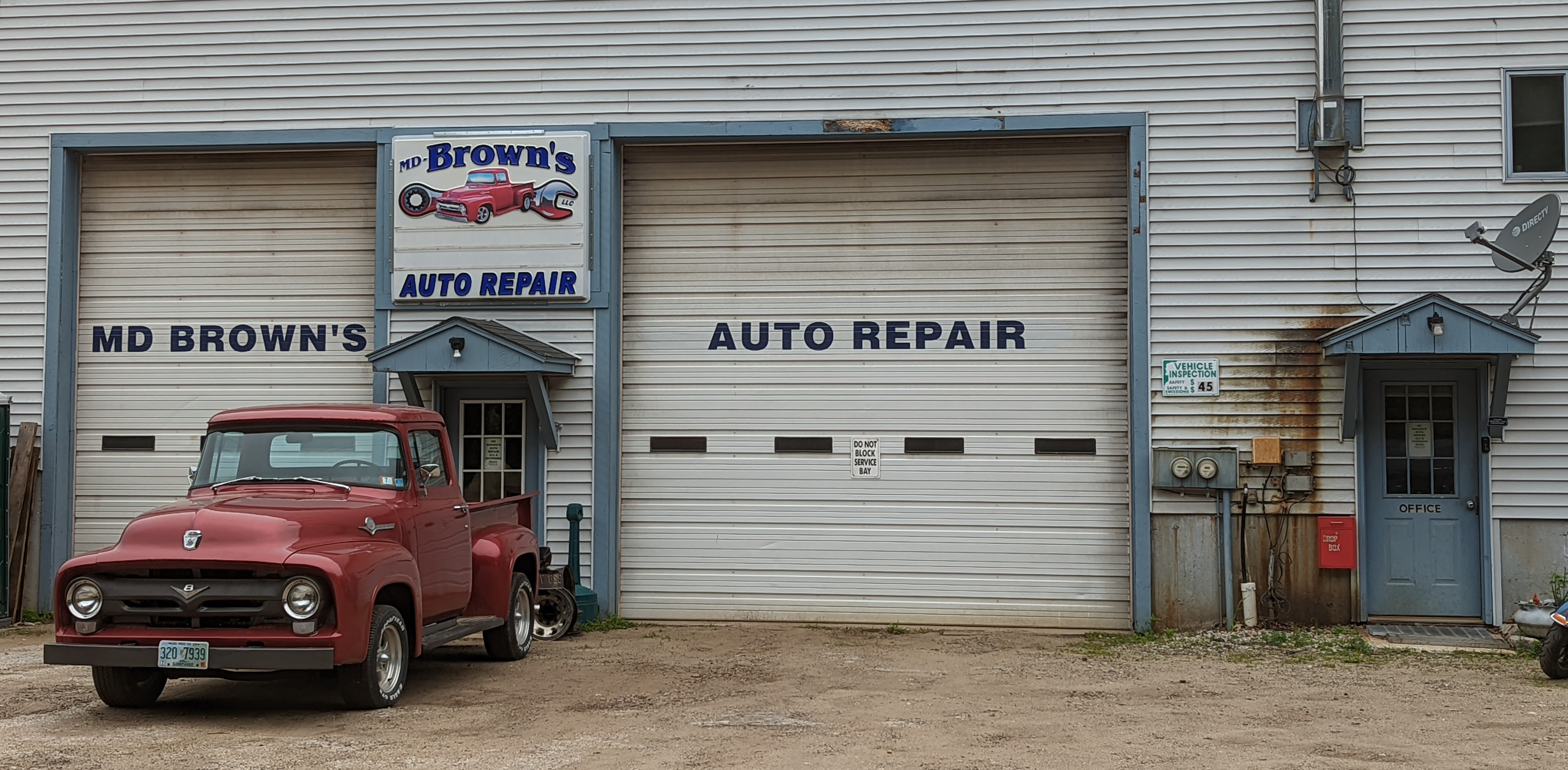 MD-Brown’s two-bay shop with its vintage red truck on Dowboro Road