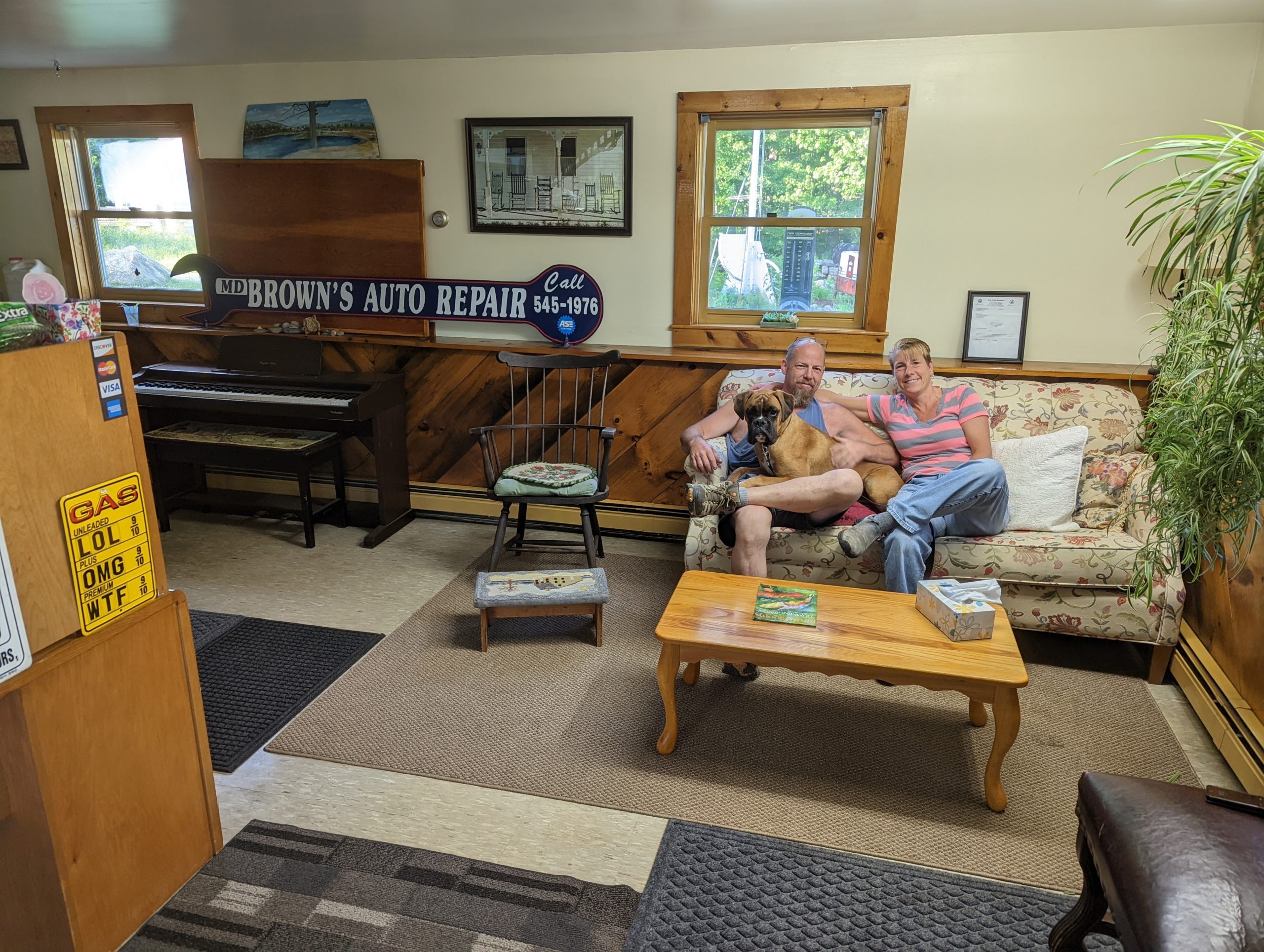 A welcoming view inside MD-Brown’s shop with people and a dog in the waiting area